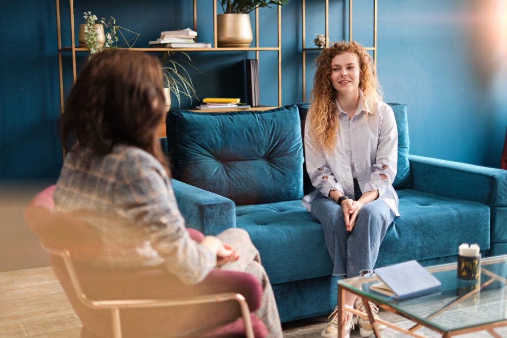 Young woman getting help from a therapist counselor.